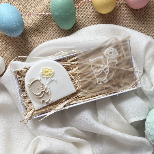 Bear Holding A Sunflower